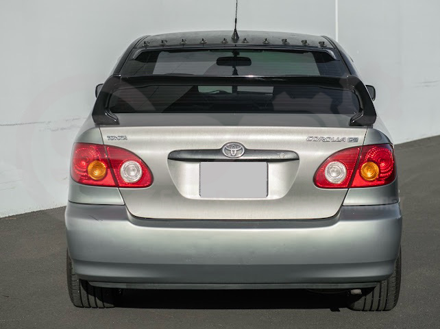 2003-2008 Toyota Corolla | JDM Tape-On Tinted Black Rear Roof Window Visor Guard