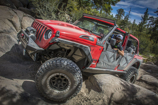 Black DV8 Offroad front inner fenders for 2018+ Jeep Wrangler JL wheel well liners, showcasing the durable, custom-fit design.
