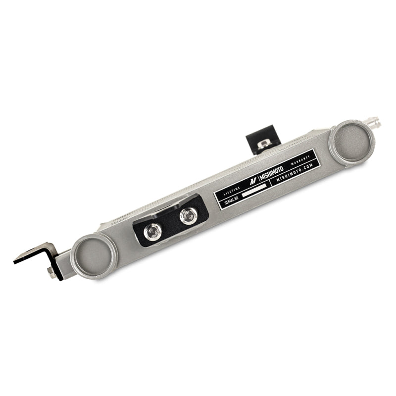 Mishimoto transmission cooler kit installed in a Toyota FJ Cruiser, showing the radiator and hoses for efficient transmission cooling.