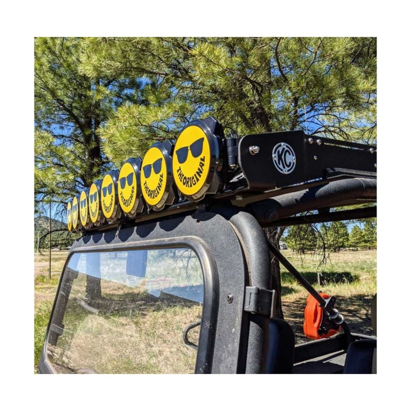 Yellow and black KC HiLiTES 6-inch hard cover with smiley face design for Gravity Pro6 LED lights, featuring KC logo.