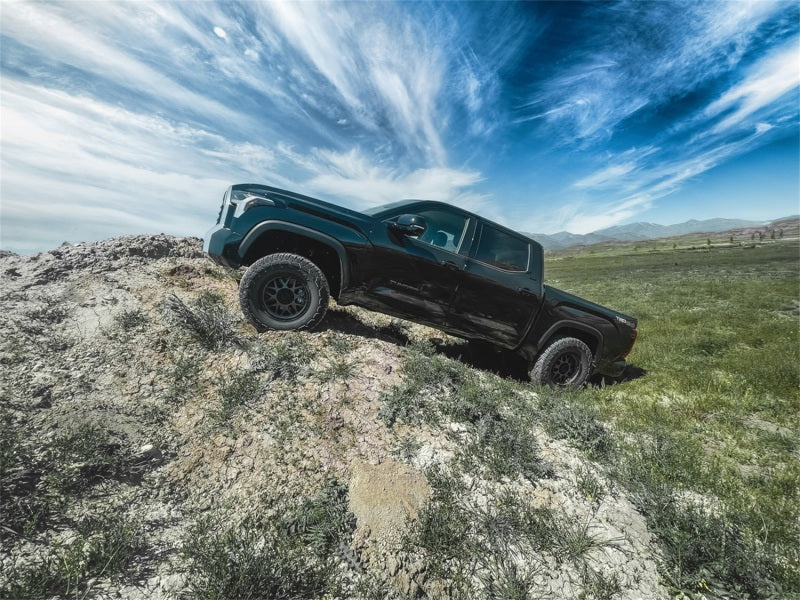 Tuff Country 2-inch leveling kit installed on a 2022 Toyota Tundra or 2023 Sequoia, showing the front suspension adjustment