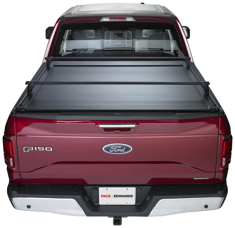 Pace Edwards UltraGroove retractable bed cover on a 2017 Ford F-Series Super Duty 6ft 9in truck bed, made of durable metal.
