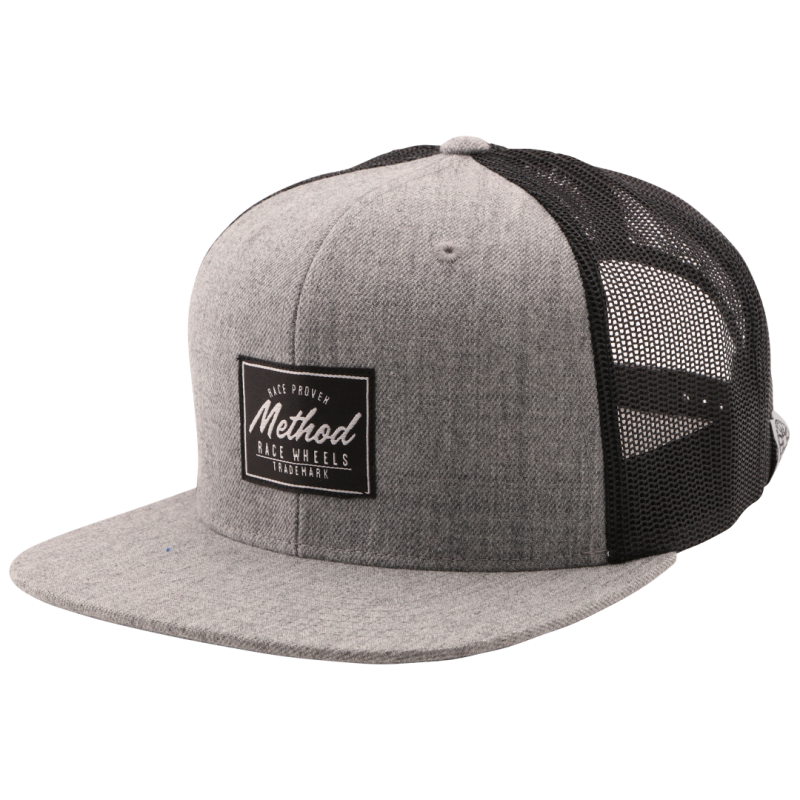 Method Race Proven Trucker Hat Snapback in Heather Grey and Black, featuring a structured design and adjustable snapback closure.