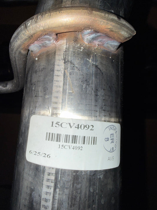 Open box CORSA Performance Double X-Pipe Exhaust connecting pipes for Cadillac CT5-V Blackwing, black metal with welds visible.