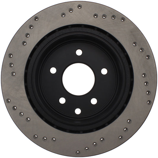 StopTech drilled right rear brake rotor for Infiniti EX35, G35, G37, M35, M45 models, showcasing the drilled surface and vented design.