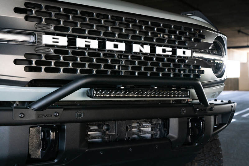 DV8 Offroad light mounts for 2021-2022 Ford Bronco factory bumper bull bar in black, designed for off-road vehicle lighting.