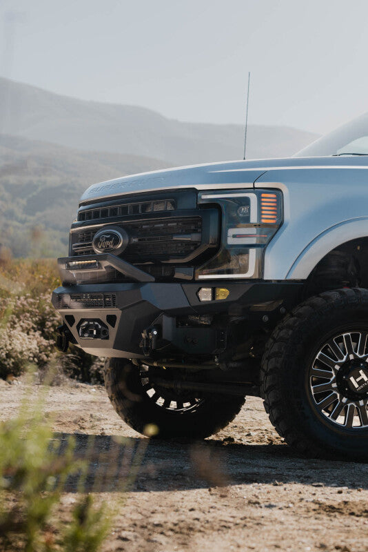 Steel DV8 Offroad front bumper for Ford Super Duty F-250 and F-350 (2017-2022) with heavy-duty construction and integrated mounting points.