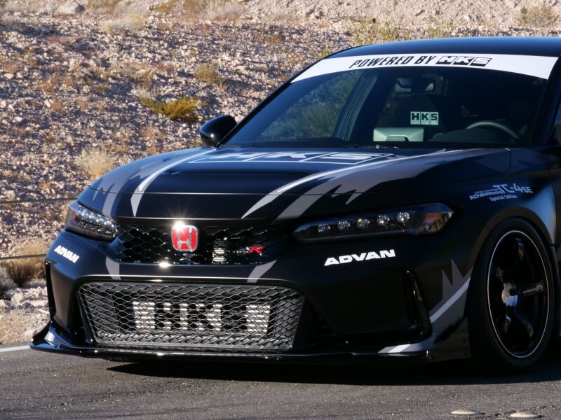 HKS Honda Civic Type R FL5 intercooler kit showing the full intercooler with brand logo and piping installed in the engine bay