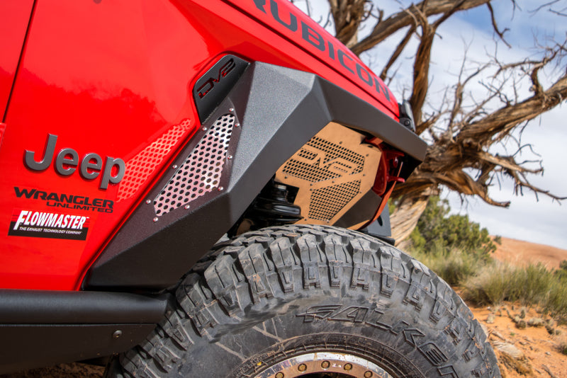 DV8 Offroad Jeep Wrangler JL armor fenders with LED turn signal lights, showcasing rugged steel construction and integrated lighting.
