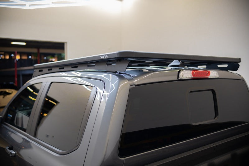 Aluminum roof rack for Ford Ranger and Ranger Raptor by Rival 4x4, mounted on the vehicle's roof for added cargo capacity.
