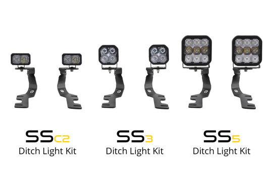 Diode Dynamics Stage Series ditch light bracket kit mounted on a 2019-present Ram truck for off-road lighting.