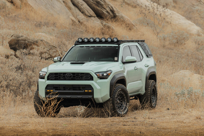 DV8 Offroad exterior window molle panel for Toyota 4Runner 25-26 model, mounted on driver side roof rack exterior trim accessory.