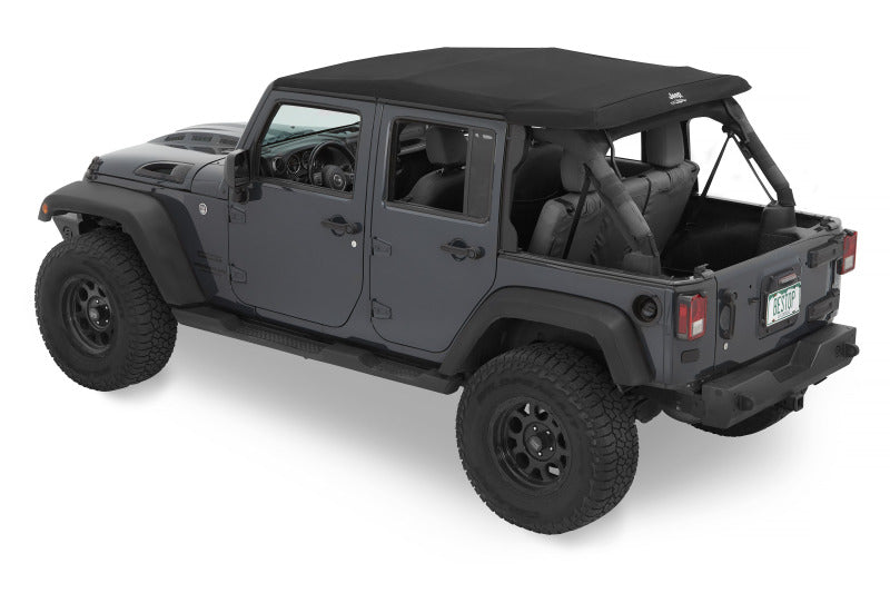 Bestop Trektop Glide soft top for Jeep Wrangler JK 4-door in black diamond, featuring fabric and window panels installed on vehicle