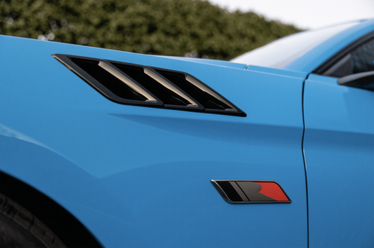 Gloss black Roush Mustang hood vents with heat extractors, designed for 2015-2023 Roush Mustangs, mounted on the fender.