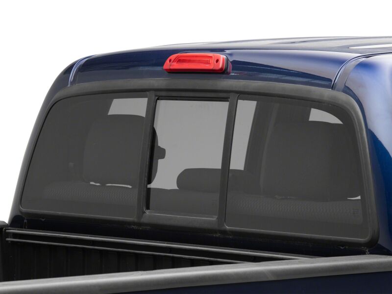 Raxiom LED third brake light in red for 2005-2015 Toyota Tacoma, axial series, mounted on vehicle tailgate.