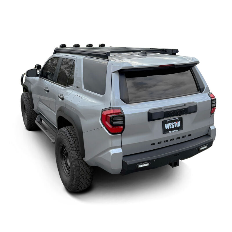 Westin 25-26 Toyota 4Runner Mesa roof rack mounted on vehicle roof, featuring sturdy metal bars for cargo storage.