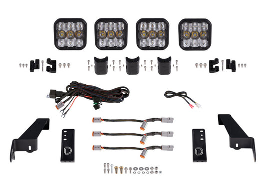 Diode Dynamics Jeep JL SS5 4-Pod CrossLink grille lightbar kit with white combo LED lights mounted on Jeep grille.