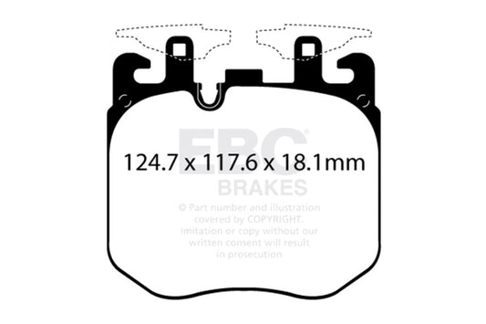EBC OE brake rotors and S12 brake pads kit installed on a vehicle's wheel assembly showing rotor surface and brake pad placement.