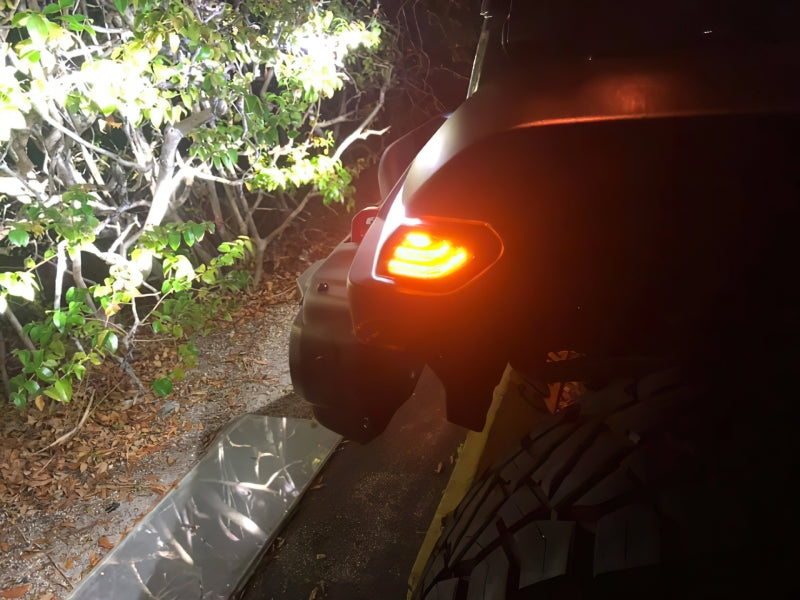 Oracle Lighting Jeep Wrangler JL smoked lens LED front sidemarkers with light strip design on a vehicle.