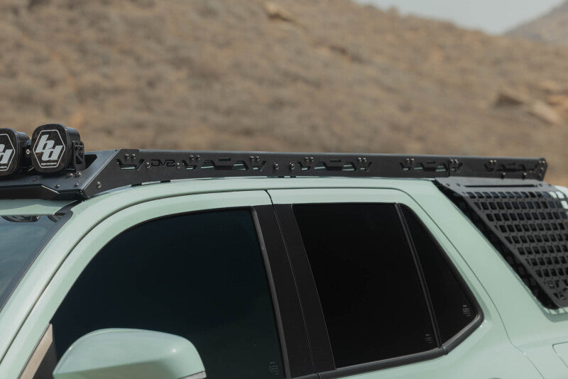 DV8 Offroad Toyota 4Runner exterior window molle panel for DV8 roof rack driver side trim in black plastic.