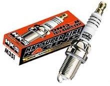 HKS Super Fire M35G racing spark plug showing metal tip and ceramic insulator in close-up view