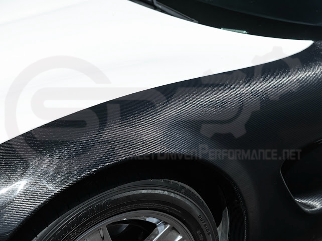Factory style carbon fiber front and rear widebody fenders for Chevrolet Corvette C5 1997-2004 by Street Driven Performance.