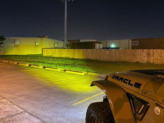 Oracle 60mm 15W Fog Beam LED emitter in 3000K, designed for fog lights, showcasing the compact LED light with clear lens.