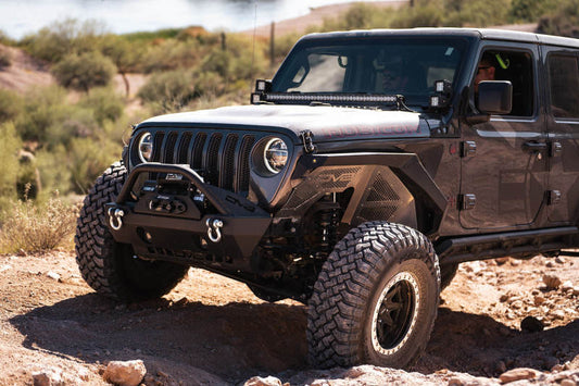 DV8 Offroad Jeep Wrangler JL 2018+ front inner fenders, black wheel well liners, showing textured surface and mounting edges