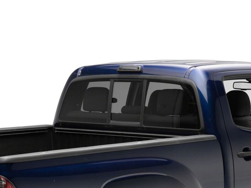 Raxiom smoked LED third brake light for Toyota Tacoma 2005-2015, showing the sleek, smoked lens design on the vehicle.