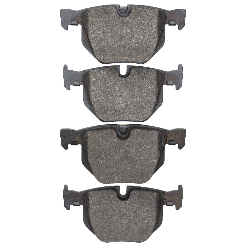 BMW 530i rear Optimum OE brake pads by R1 Concepts, showing the new brake pads with metal backing and friction material.