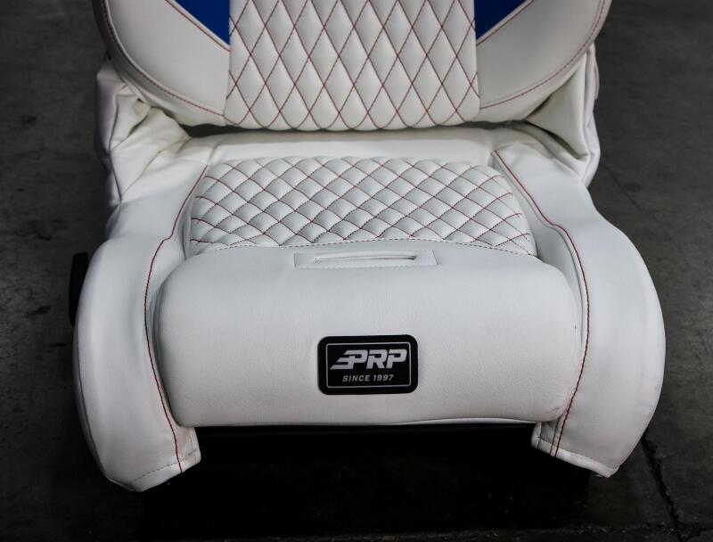 PRP Seats EnduroDaily reclining suspension seat for passengers, black and green vinyl, with padded backrest and adjustable features.