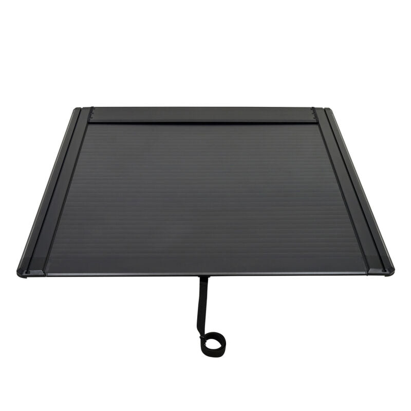 Black Westin roll-up tonneau cover on Silverado/Sierra 1500 5ft 8in bed, manual retractable design.
