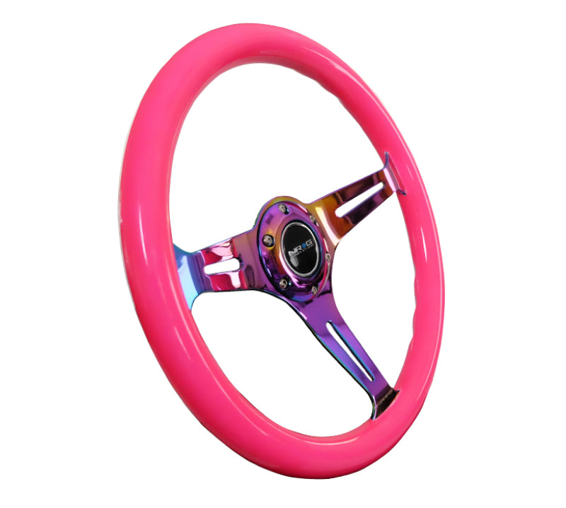 NRG Classic wood grain steering wheel with neon pink grip and neochrome 3-spoke center for car interior customization.