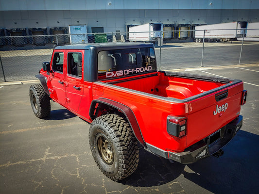 Steel rear bumper for 2018+ Jeep Gladiator by DV8 Offroad, rugged off-road bumper with durable construction and mounting details.