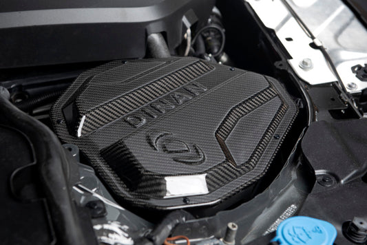 Dinan carbon fiber cold air intake for BMW M240i, M340i, M440i G20, G22, G23, G26, G42 models showing sleek air intake components