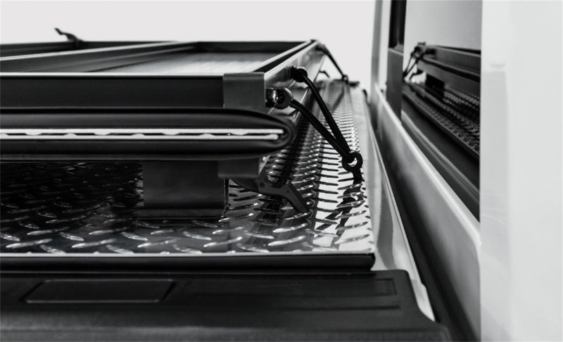 Access LOMAX tri-fold truck bed cover in matte black on a 2020+ Chevy/GMC full-size 2500/3500 with 6ft 8in bed, exterior truck accessory.