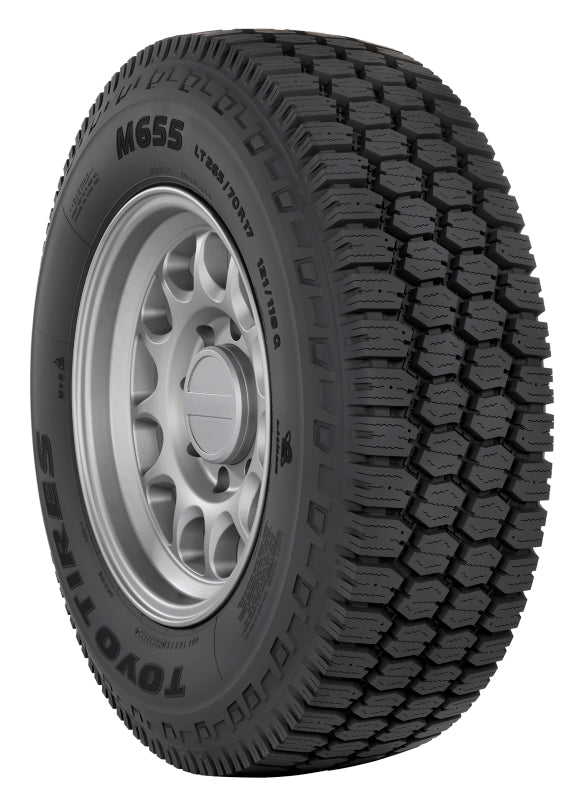 Toyo M655 11R24.5 off-road UTV tire with durable tread and sidewall, designed for on-road automotive use.