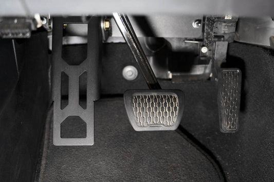 DV8 Offroad Jeep Wrangler JL 18-20 adjustable dead pedal cover, rugged pedal cover for off-road vehicle interior.