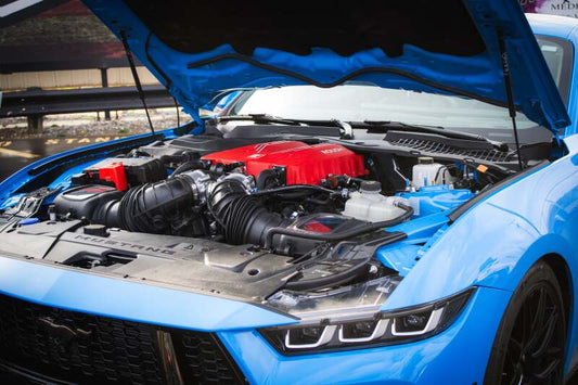 Roush 2026 Ford Mustang 5.0L supercharger kit with 810 HP, showing the Roush branded supercharger and engine components.