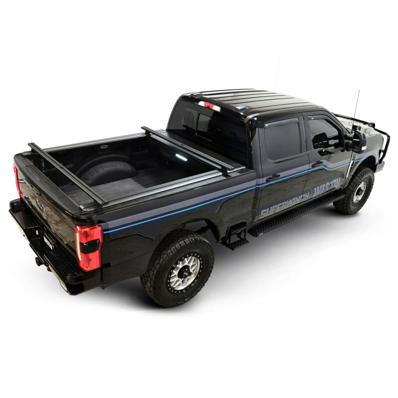 Westin retractable tonneau cover in black installed on a Ford F-250/F-350 SD with a 6.8ft bed, showing its sleek, smooth retractable design.