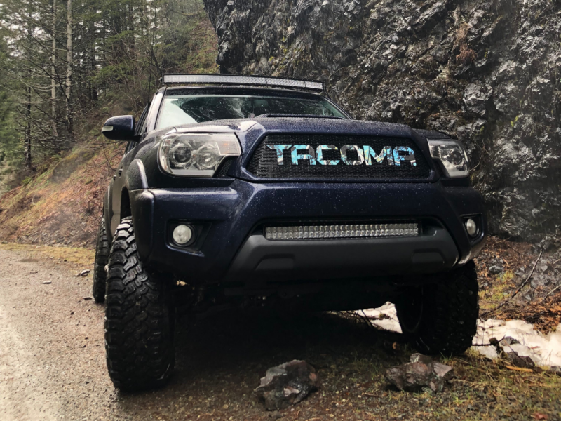 Cali Raised LED 32-inch blue backlight bumper flush LED light bar kit for 2005-2015 Toyota Tacoma, small size, mounted on front bumper