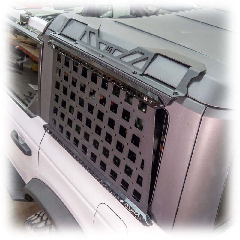 Turn Offroad 2021+ Ford Bronco 4-door side Molle panels installed on OE hard top, showcasing durable off-road accessory design