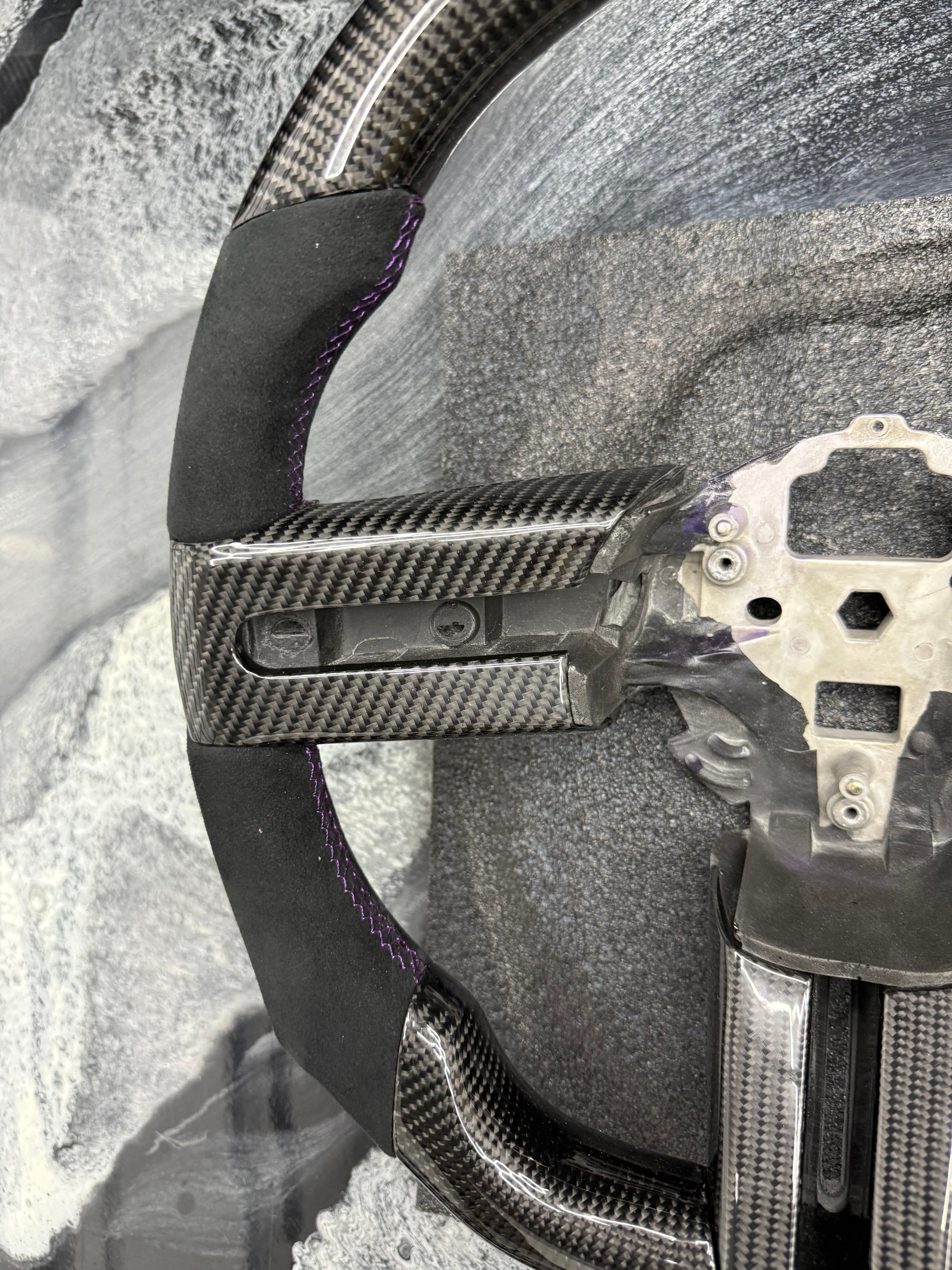 2005 - 2009 Ford Mustang S197
-Custom Carbon Fiber Steering Wheel with Alcantara Suede Hand Grips (Purple Stripe & Stitching) (IN STOCK READY TO SHIP)