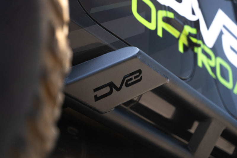 DV8 Offroad 18-23 Jeep Wrangler JL 4-door FS-15 Series rock sliders mounted on vehicle side for exterior body protection.