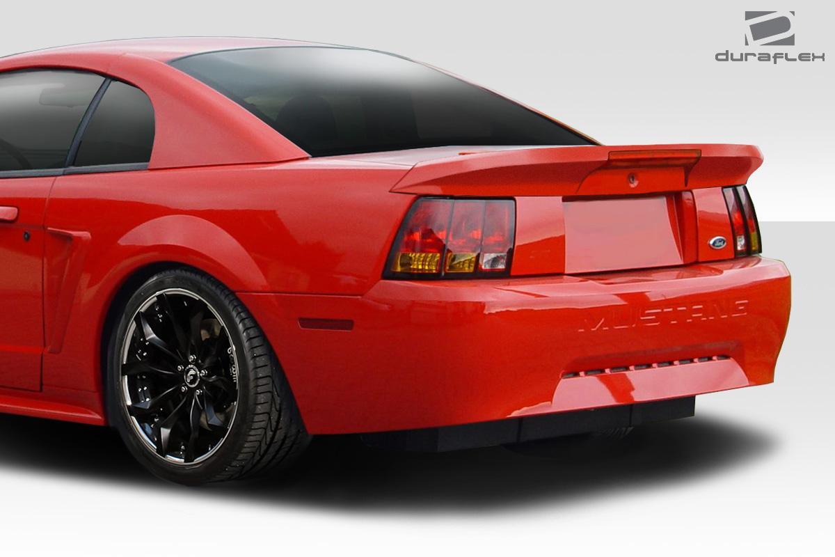 Duraflex Colt rear wing for 1999-2004 Ford Mustang, showcasing aerodynamic wing design with mounting hardware against a white background.