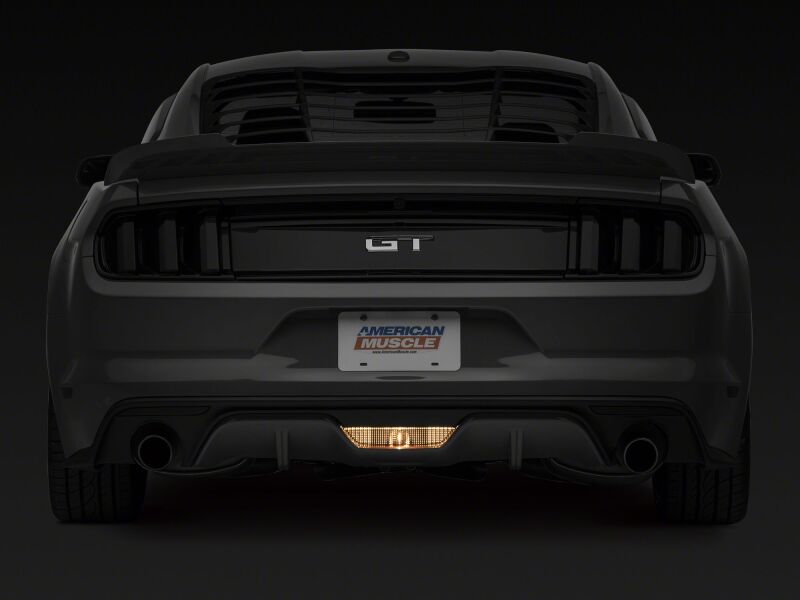 Raxiom Ford Mustang axial series reverse light LED conversion kit with light bars and cubes, installed on a 2015-2023 model.