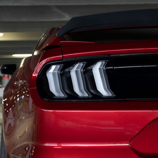 Pair of FORM Lighting smoked LED tail lights for 2015-2023 Ford Mustang, showing sleek, smoked lens design with LED illumination.