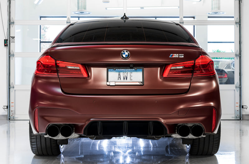 AWE Tuning 18-19 BMW M5 F90 axle-back exhaust with diamond black tips, showcasing the sleek exhaust pipes and polished finish.