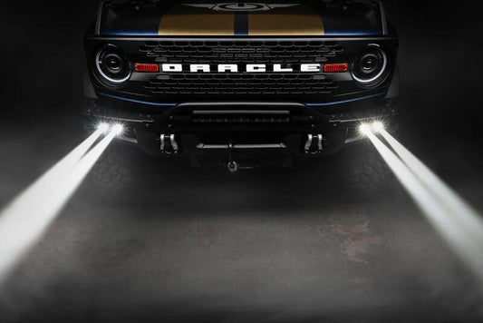Oracle Lighting fog lights kit for 2021-2024 Ford Bronco with off-road laser and LED fog lights installed on steel bumper.