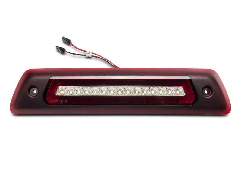 Raxiom LED third brake light for 09-14 Ford F-150 excluding Raptor, with clear lens and multiple LED bulbs.